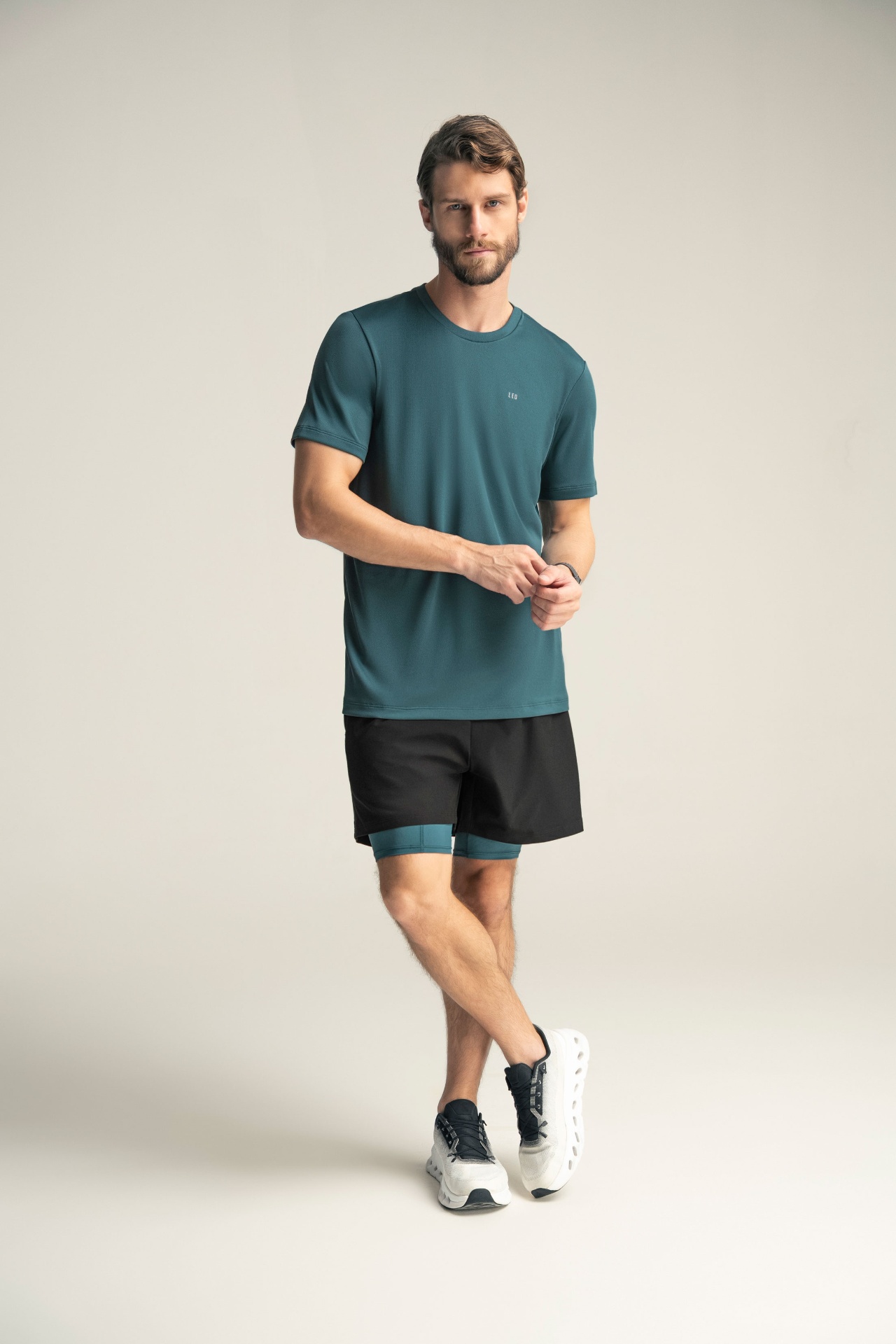 Full-body activewear studio portrait
