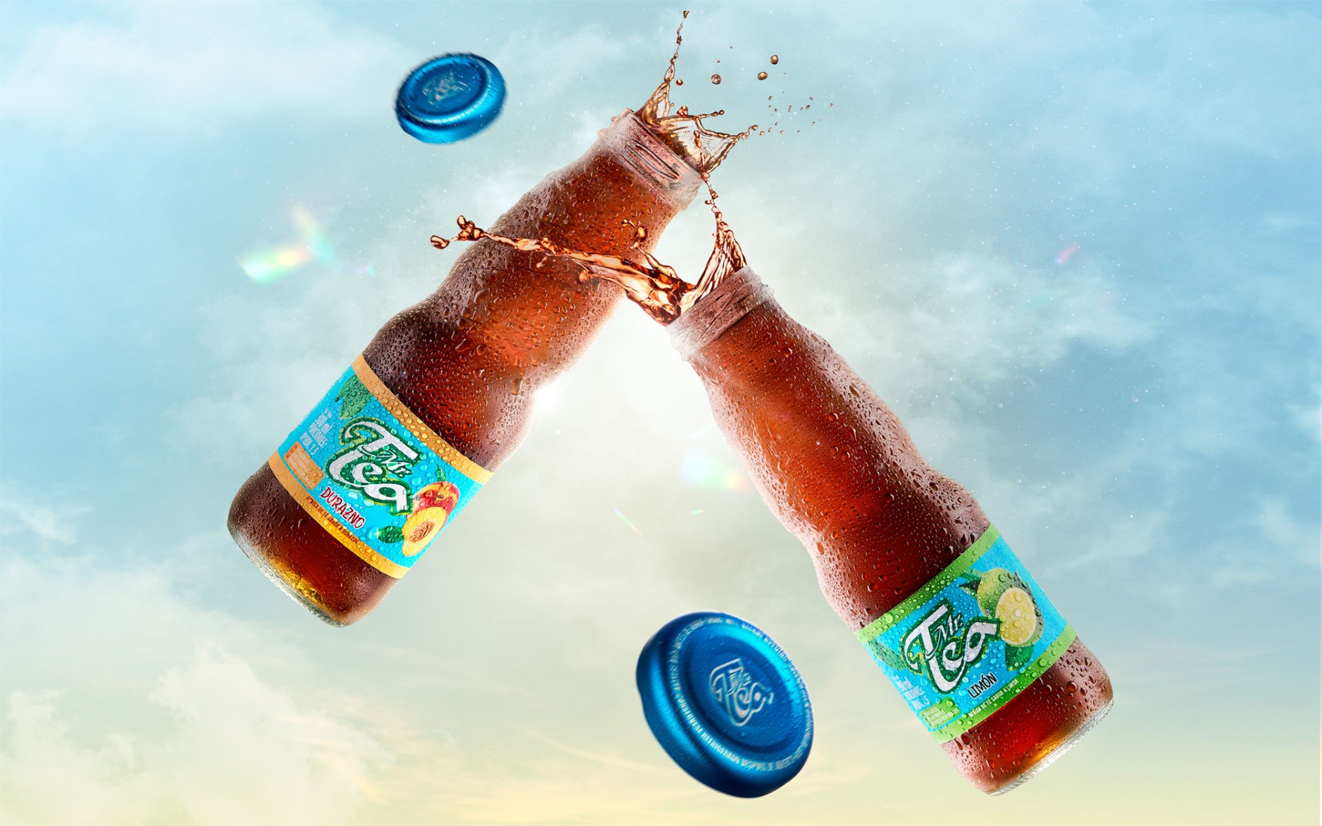 Mr. Tea bottles clashing mid-air with splash against sky
